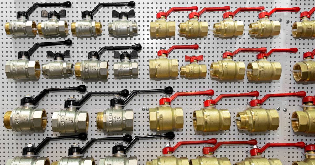 Various types of hydraulic ball valves on display, featuring both stainless steel and brass options for different applications.